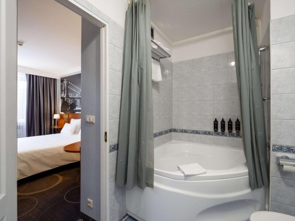 Posteľ alebo postele v izbe v ubytovaní Mercure Czestochowa Centrum