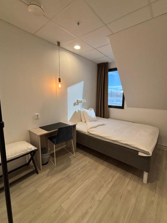 Postel nebo postele na pokoji v ubytování Hotell Fyrislund
