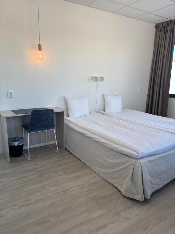 Postel nebo postele na pokoji v ubytování Hotell Fyrislund