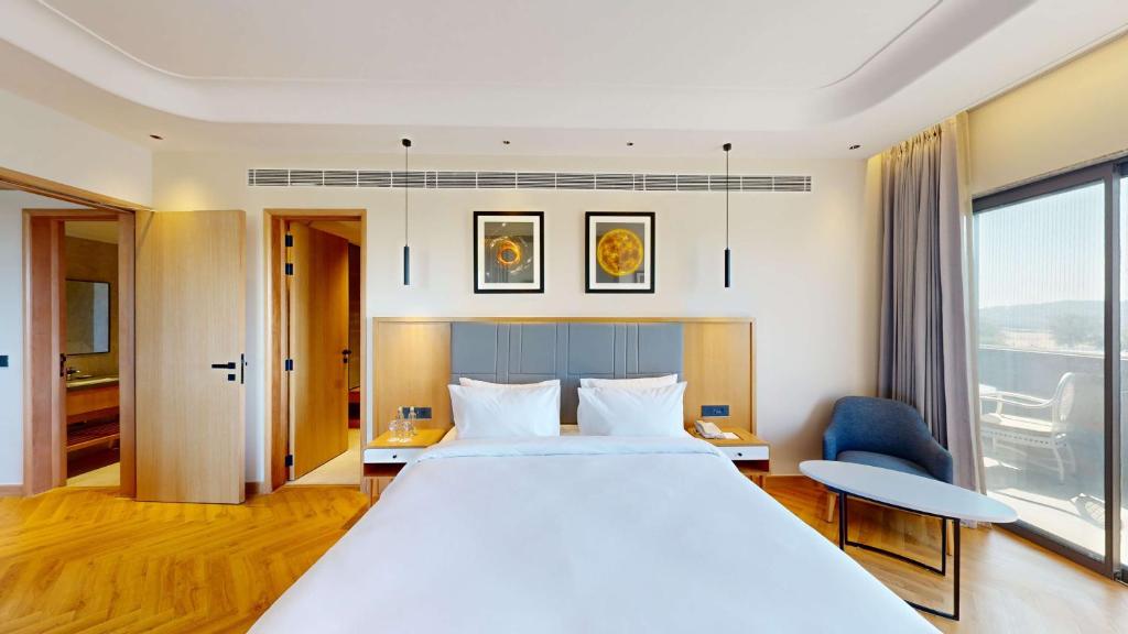 Postel nebo postele na pokoji v ubytování Radisson Hotel Nathdwara