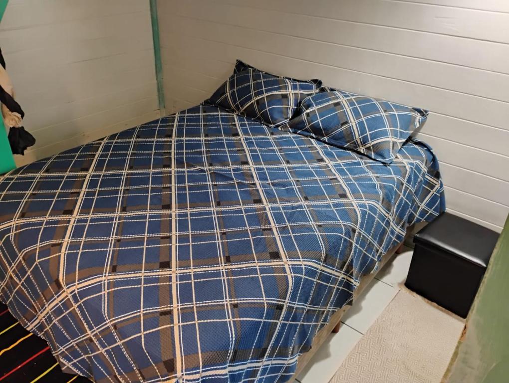 Giường trong phòng chung tại casa entre praias