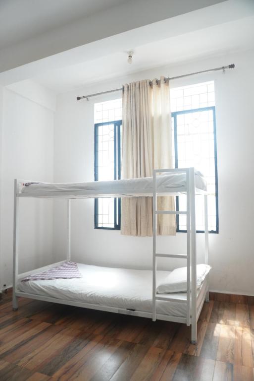 Cama o camas de una habitación en This is it Beachfront - Rooms, Cafe & Events