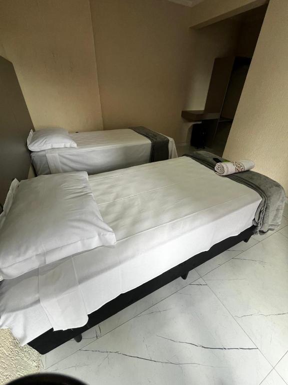 Postel nebo postele na pokoji v ubytování Hotel Aris