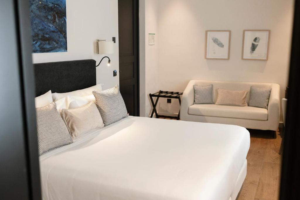 Postel nebo postele na pokoji v ubytování Hotel Boutique Sidonia