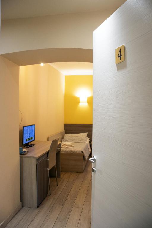Postel nebo postele na pokoji v ubytování ALBERGO LOCANDA DIANA