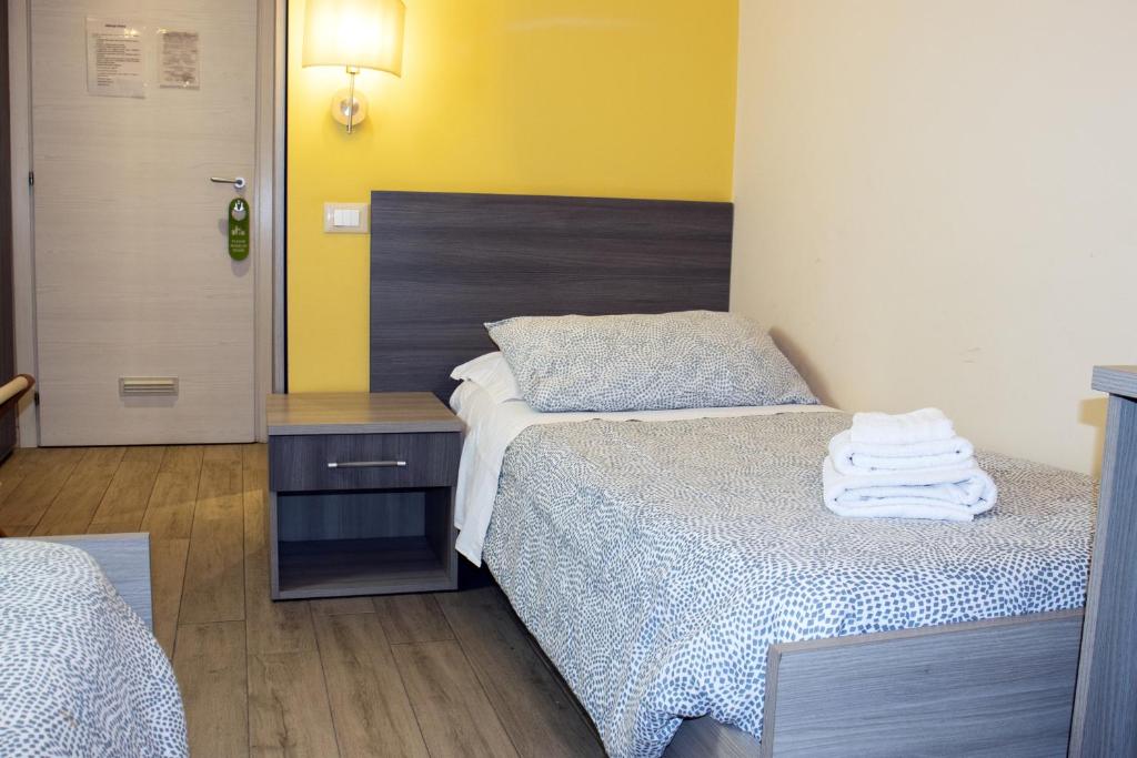 Postel nebo postele na pokoji v ubytování ALBERGO LOCANDA DIANA