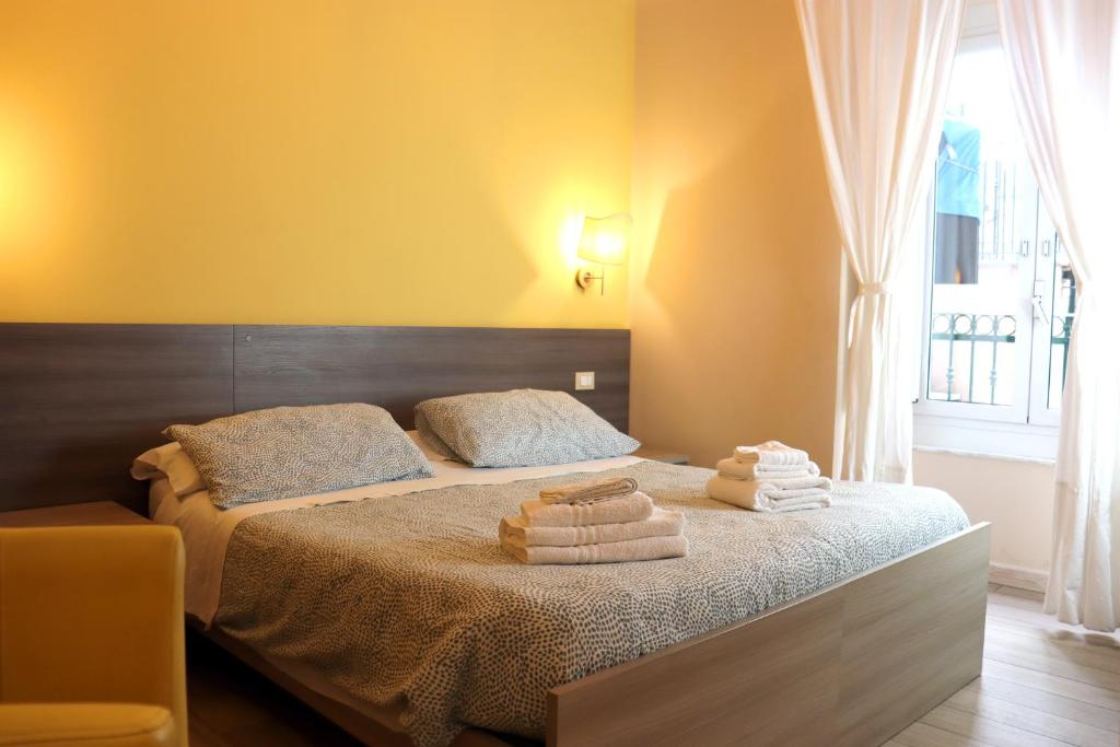 Postel nebo postele na pokoji v ubytování ALBERGO LOCANDA DIANA