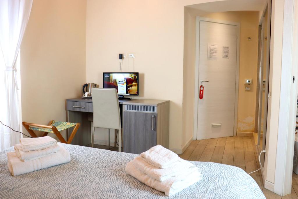 Postel nebo postele na pokoji v ubytování ALBERGO LOCANDA DIANA