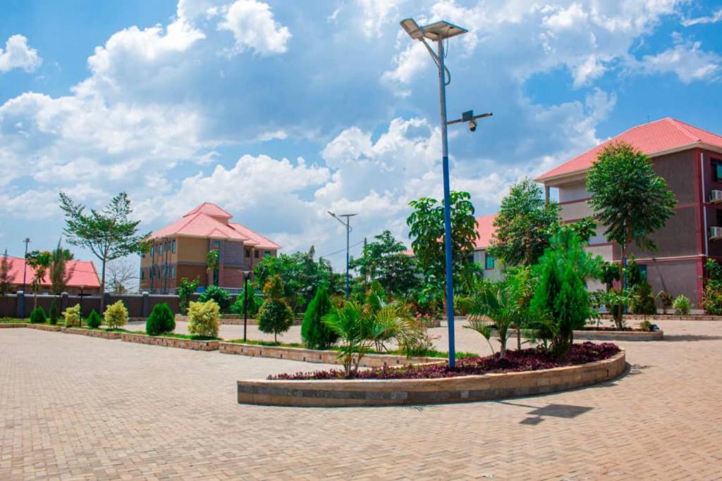 a street light in a courtyard in front of a building at Golden Ark Resort Hotel in Soroti