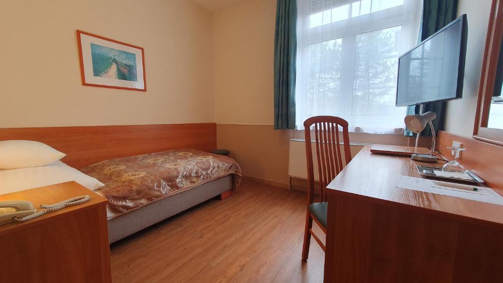 Telewizja i/lub zestaw kina domowego w obiekcie Hotel Baross