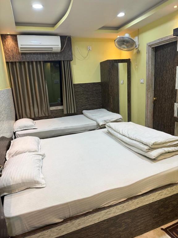 Postel nebo postele na pokoji v ubytování Sidra Guest House