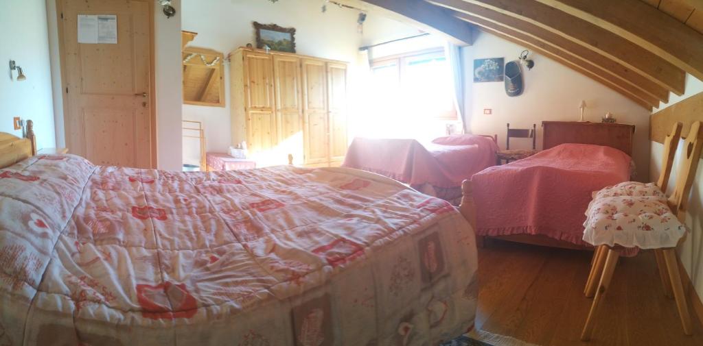 Postel nebo postele na pokoji v ubytování B&B Dolomiti