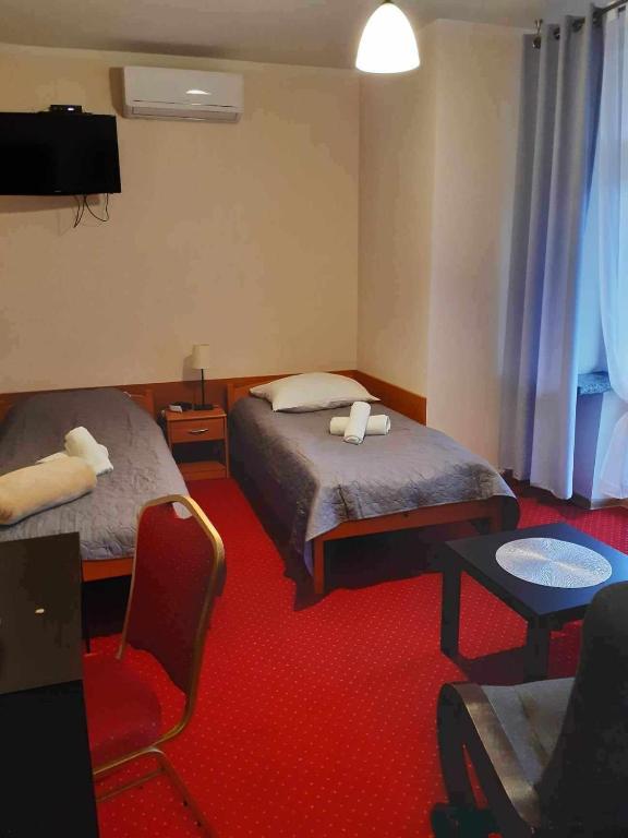 Televízia a/alebo spoločenská miestnosť v ubytovaní MADOHORA_SŁOŃCE
