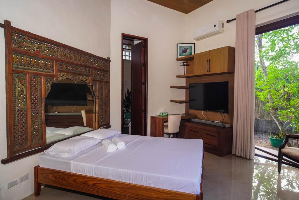 Postel nebo postele na pokoji v ubytování CORON RIVERSIDE Guesthouse