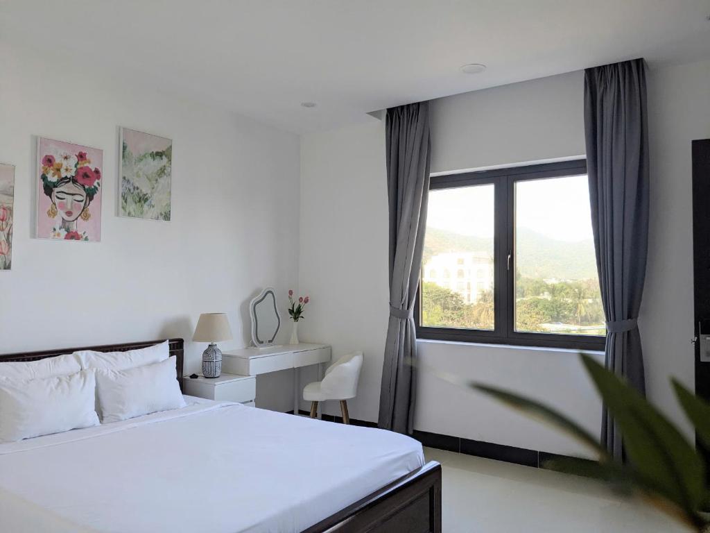 Postel nebo postele na pokoji v ubytování Horizon Côn Đảo Hotel