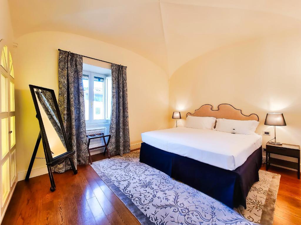 Postel nebo postele na pokoji v ubytování Hotel L'Orologio Firenze - WTB Hotels