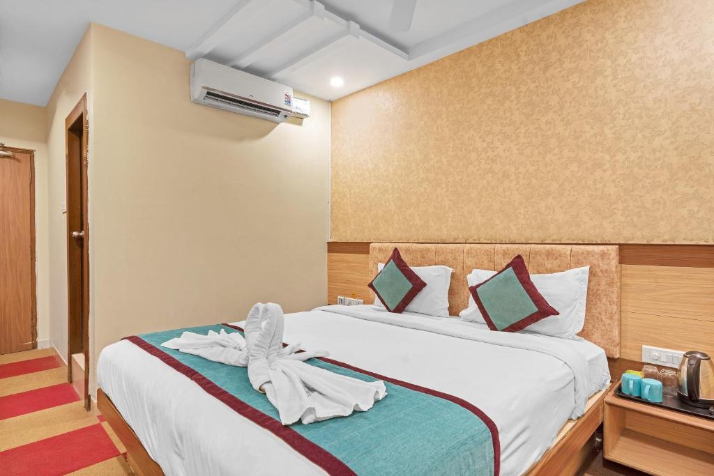 Postel nebo postele na pokoji v ubytování Hotel SM Deccan Park