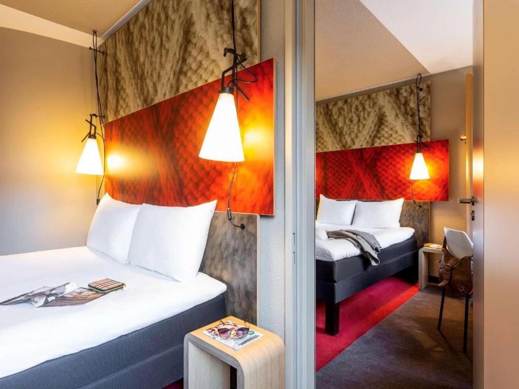 Postel nebo postele na pokoji v ubytování Ibis Hamburg City