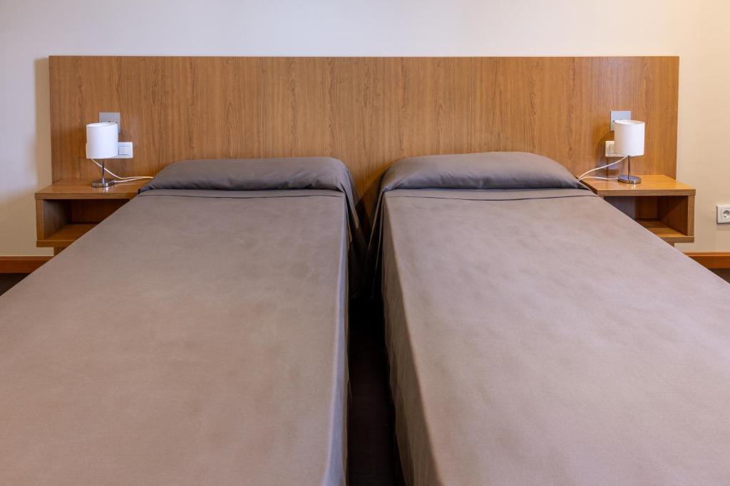 Postel nebo postele na pokoji v ubytování AS Hoteles Ponferrada