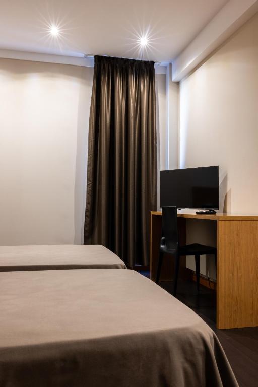 Postel nebo postele na pokoji v ubytování AS Hoteles Ponferrada