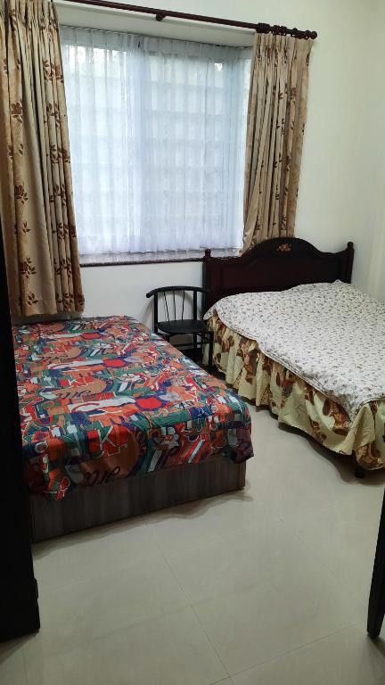 Postel nebo postele na pokoji v ubytování Taiwan Third Line Fengjing B&B