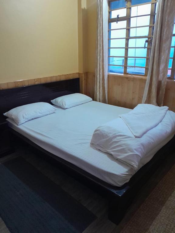 Postel nebo postele na pokoji v ubytování the DEW DROP HOME STAY