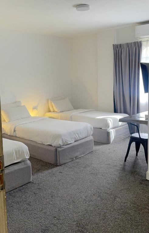 Postel nebo postele na pokoji v ubytování Nomads Hotel Petra