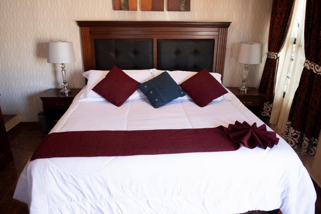 Postel nebo postele na pokoji v ubytování Hotel Villa Bernal