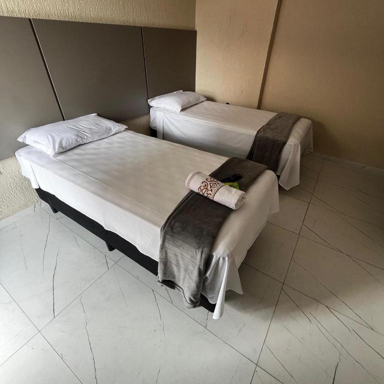 Postel nebo postele na pokoji v ubytování Hotel Aris