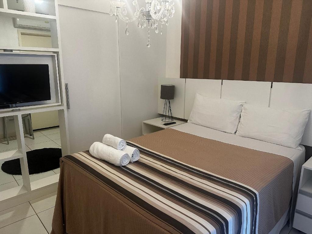 Ένα ή περισσότερα κρεβάτια σε δωμάτιο στο Lindo flat no centro de Brasilia