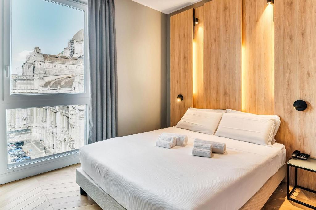 Postel nebo postele na pokoji v ubytování B&B Hotel Milano Aosta