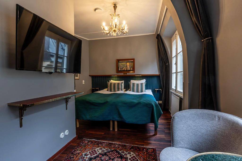 Postel nebo postele na pokoji v ubytování Lord Nelson Hotel