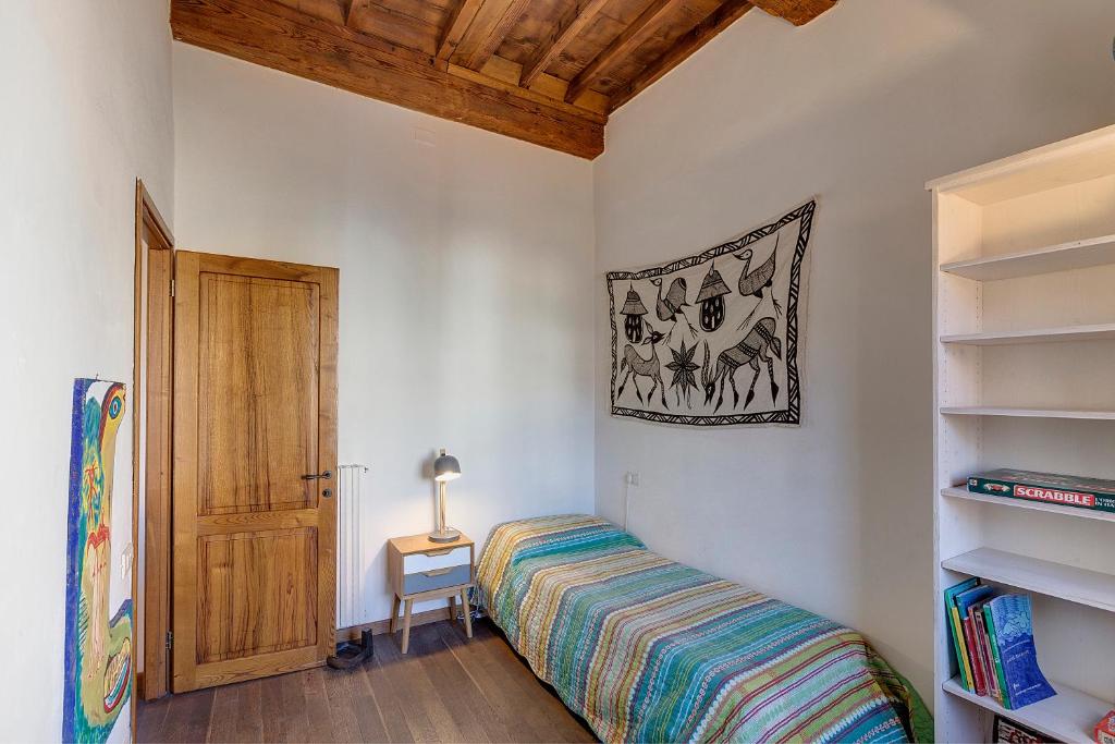 Posteľ alebo postele v izbe v ubytovaní Art Apartment Sant Ambrogio