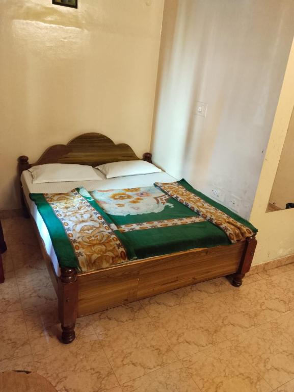 Postel nebo postele na pokoji v ubytování NKF Residency mysuru