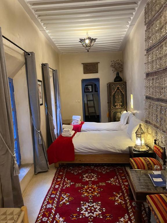 Postel nebo postele na pokoji v ubytování Riad Chameleon