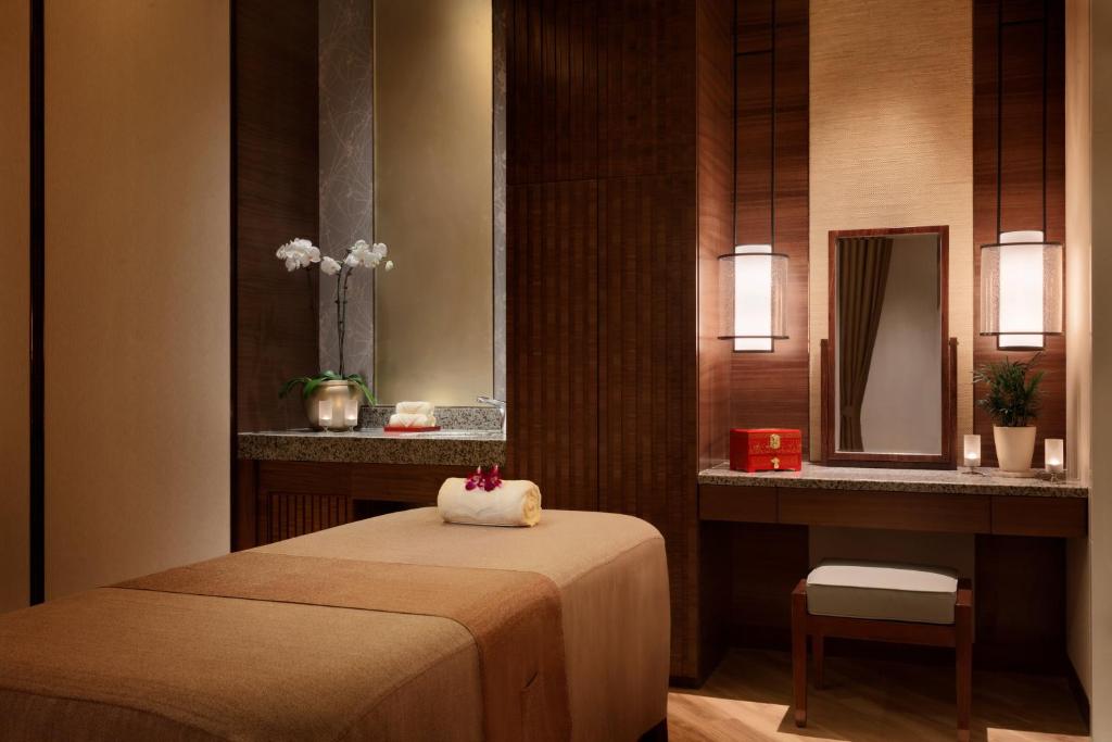 Postel nebo postele na pokoji v ubytování Shangri-La Hefei