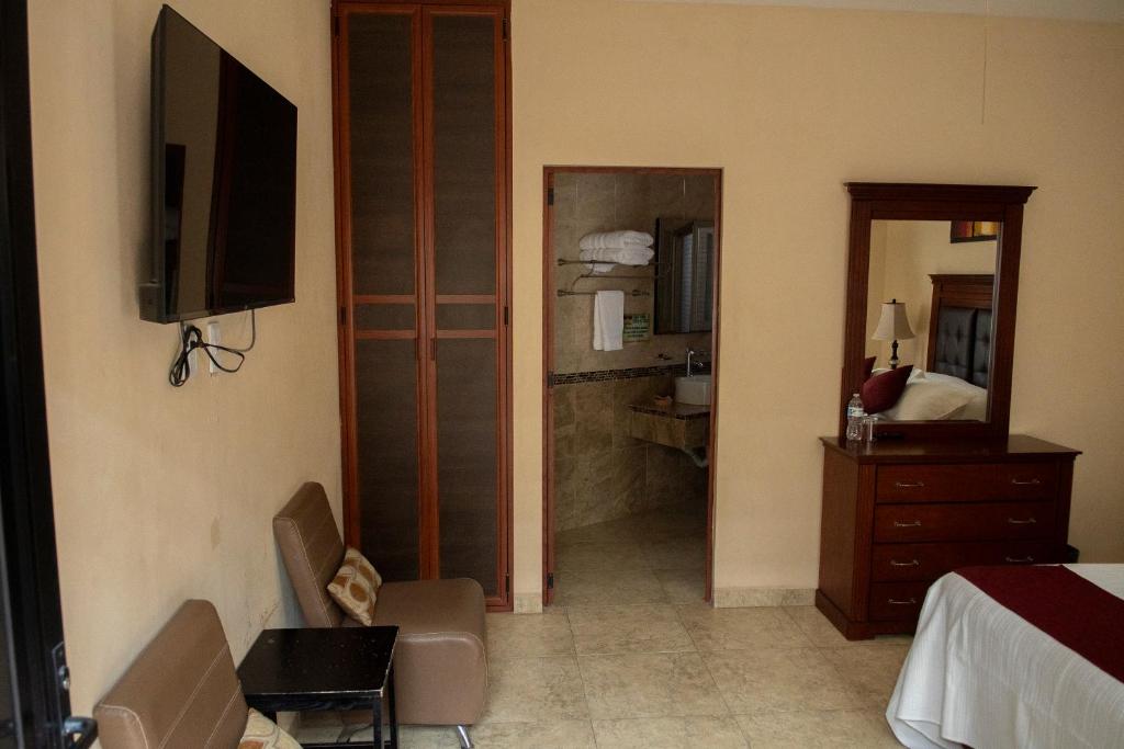 TV a/nebo společenská místnost v ubytování Hotel Villa Bernal