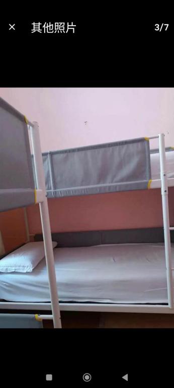 Postel nebo postele na pokoji v ubytování Qiyuan Hotel