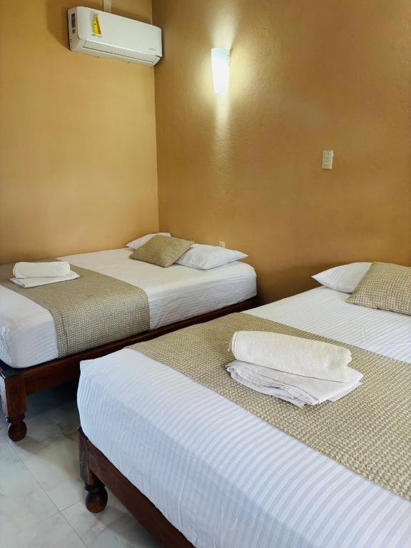 Postelja oz. postelje v sobi nastanitve Hotel Rosa de los vientos