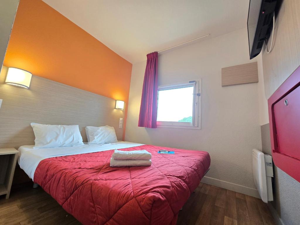Postel nebo postele na pokoji v ubytování Premiere Classe Troyes Sud - Parc St Thibault