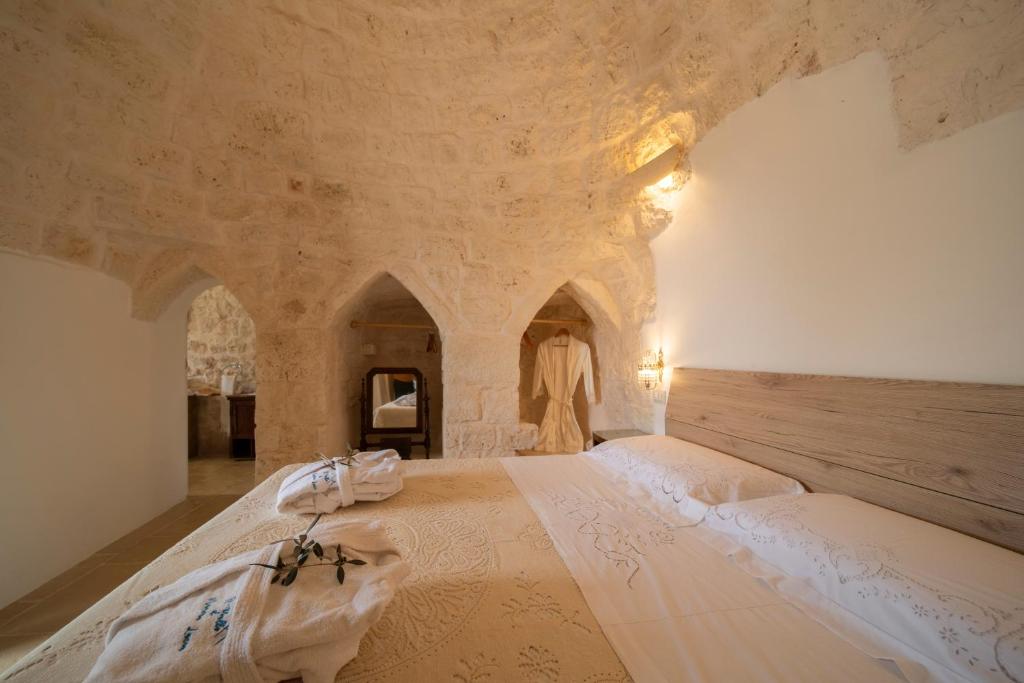 Posteľ alebo postele v izbe v ubytovaní IL Trullo Di Mamma Lucia-Luxury Villa