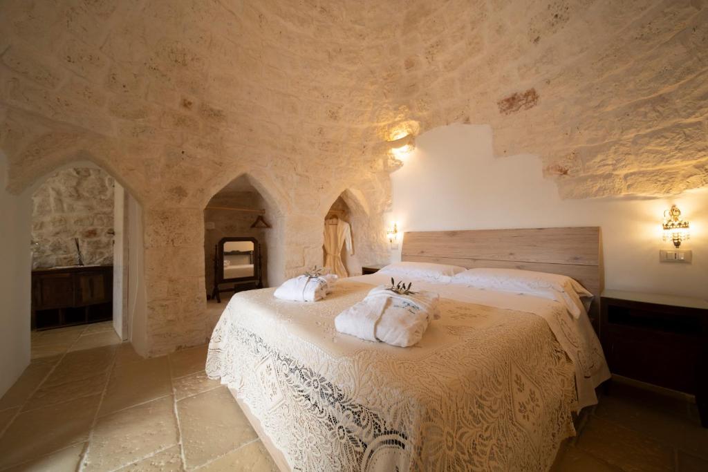 Posteľ alebo postele v izbe v ubytovaní IL Trullo Di Mamma Lucia-Luxury Villa