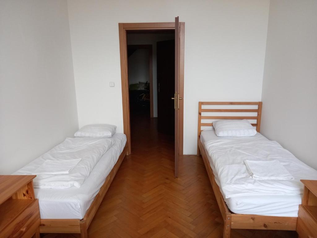 Postel nebo postele na pokoji v ubytování Penzion Kravín