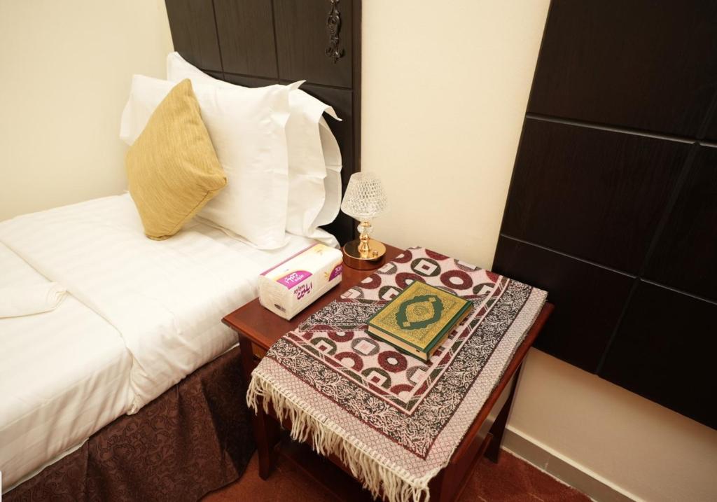 Letto o letti in una camera di فندق لدان الفضي-Lidan Alfidy Hotel