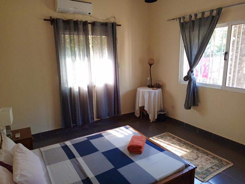 Postel nebo postele na pokoji v ubytování Casa Cacheu Homestay Guest House