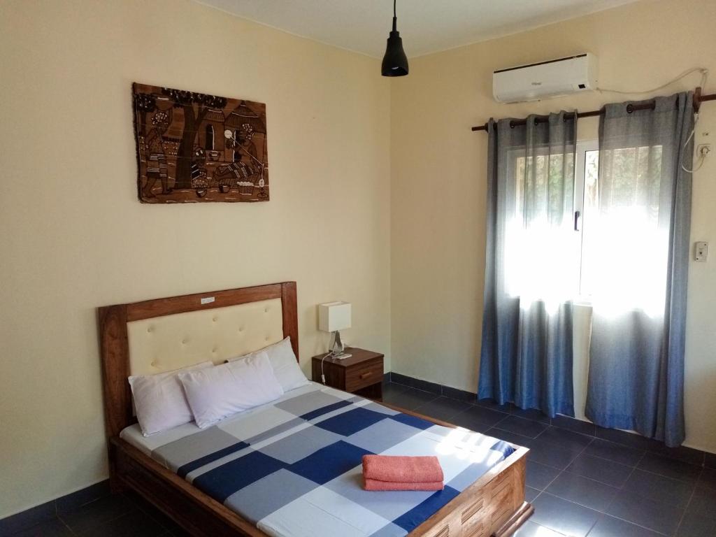 Postel nebo postele na pokoji v ubytování Casa Cacheu Homestay Guest House