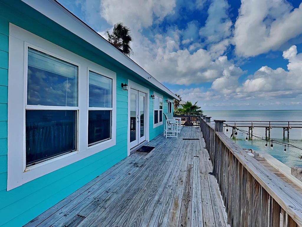 a house on the beach with a pier at Frisco- Flats in Rockport