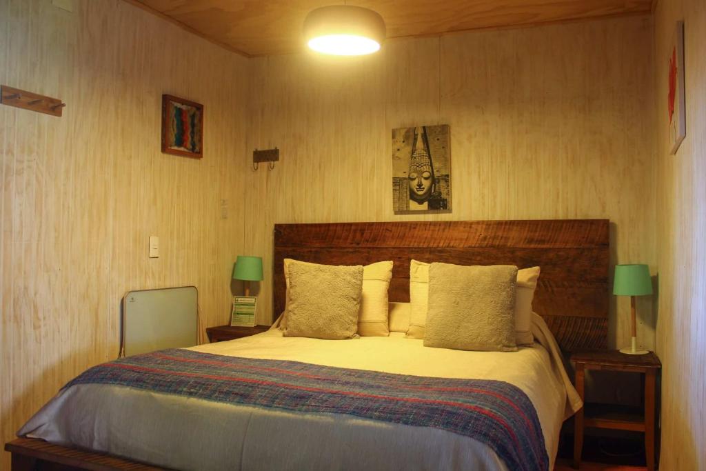 Postel nebo postele na pokoji v ubytování La Araucaria Hostería Boutique - Ex Lounge Brasil