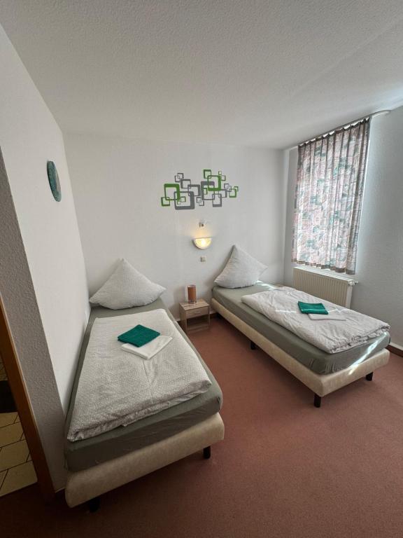 Postel nebo postele na pokoji v ubytování Pension zur Bergbahn