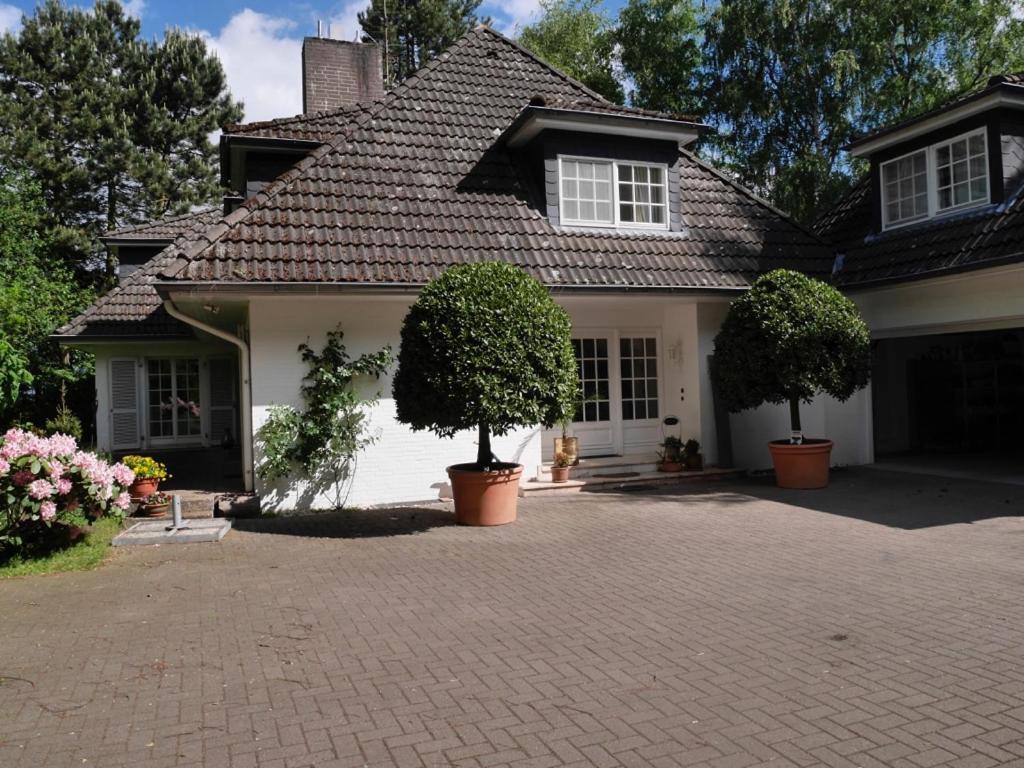 a house with a brick driveway in front of it at Villa Kükenkamp in Rätzlingen